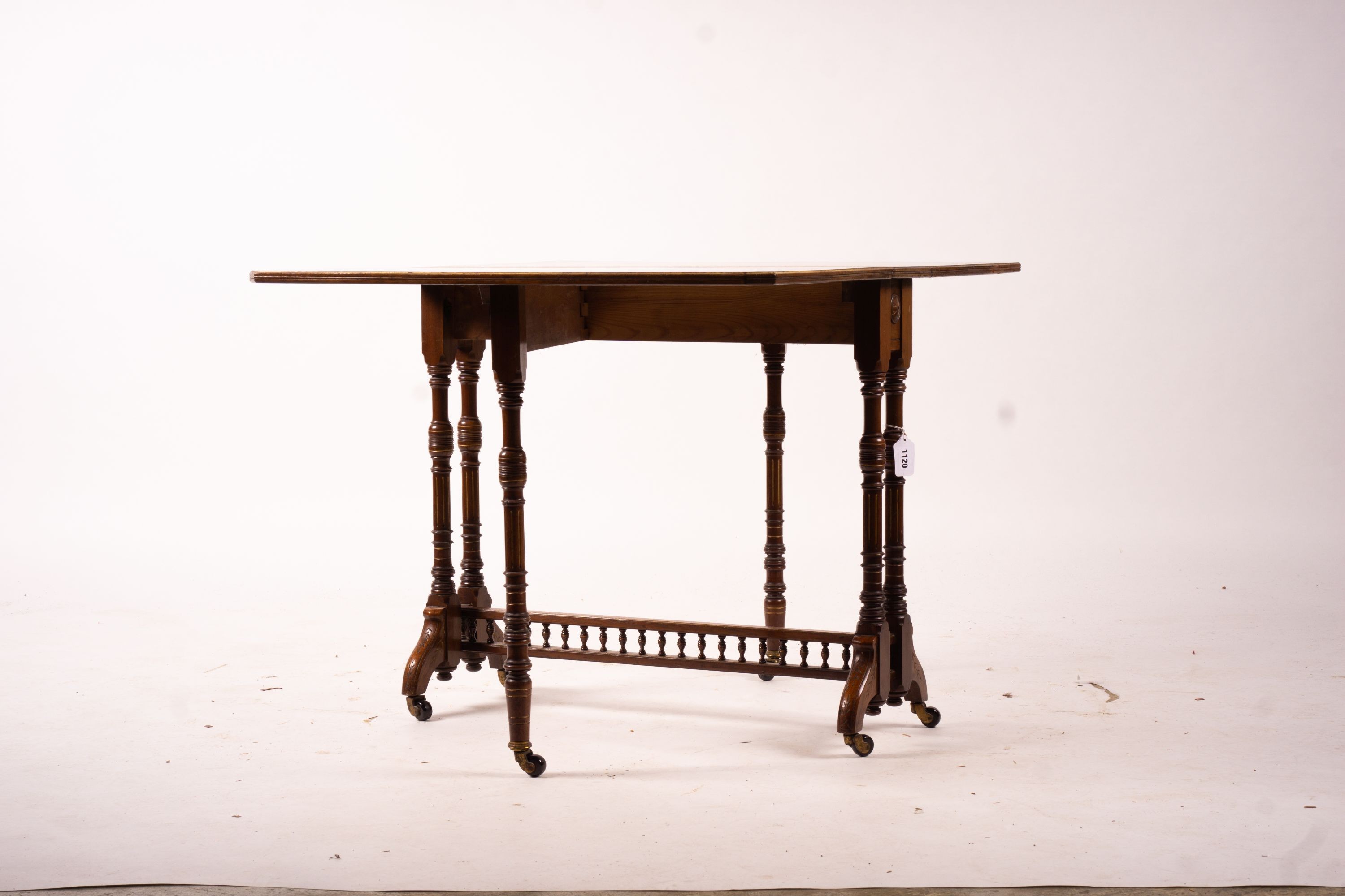 A late Victorian part ebonised walnut Sutherland table, width 76cm, depth 15cm, height 65cm